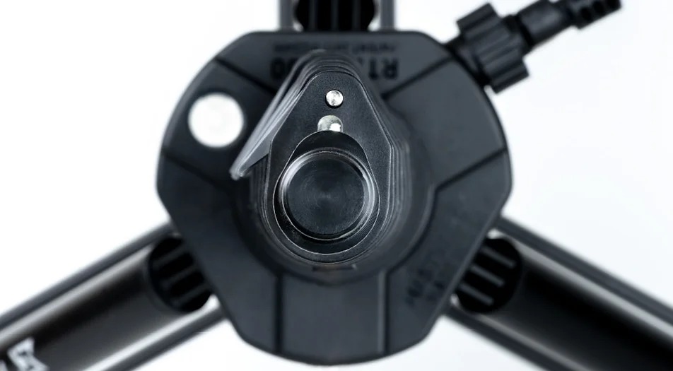 A close up of the camera 's lens and its focus on the button.